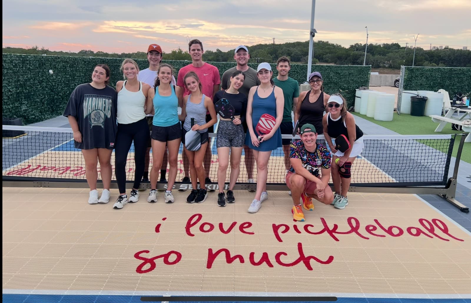 Players on an outdoor pickleball court